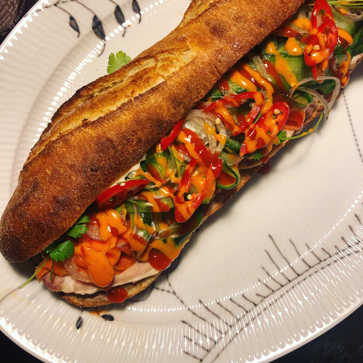 Banh mi sandwich with sriracha and mayo